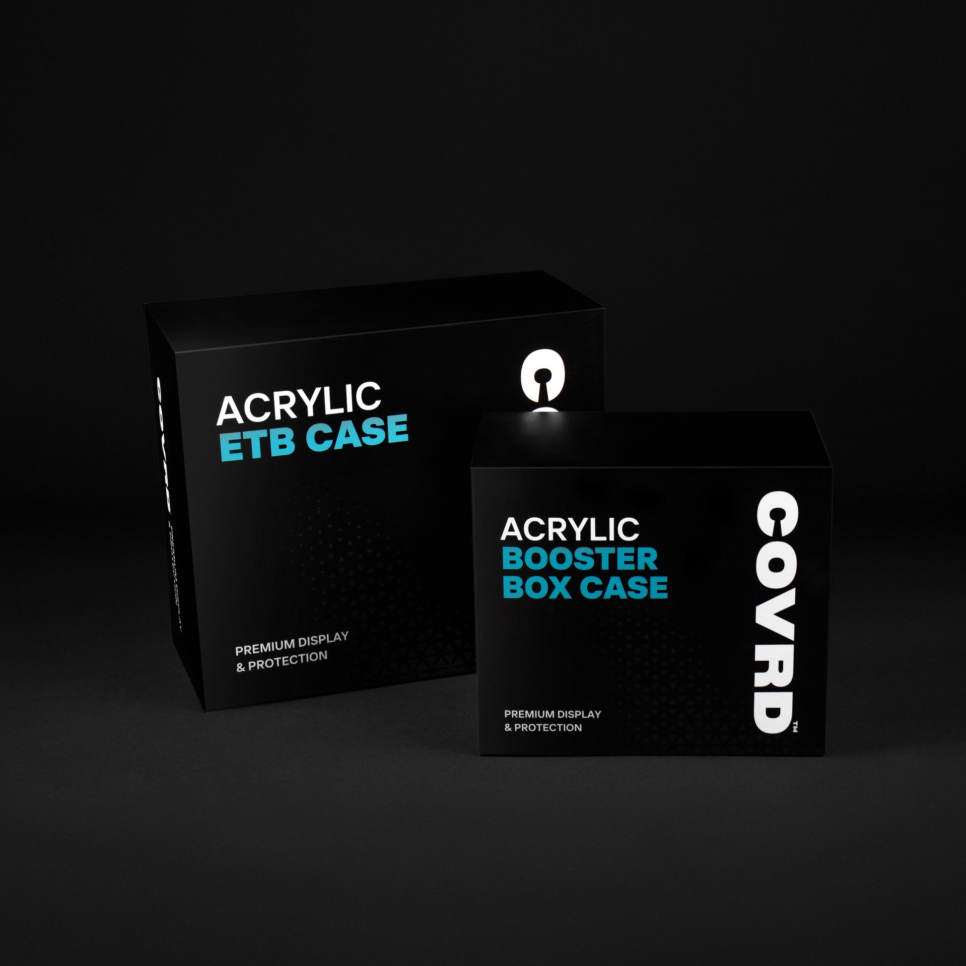 COVRD Acrylic ETB Case and Booster Box Case packaging displayed together on a dark background.