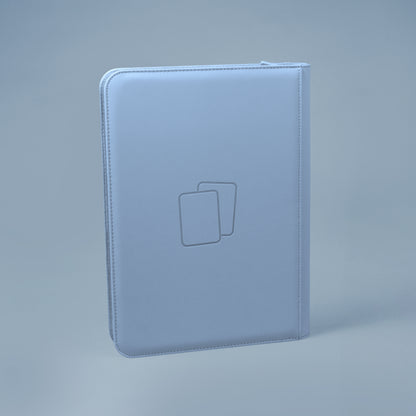 Back view of steel blue COVRD card album standing upright showing the debossed logo asset.