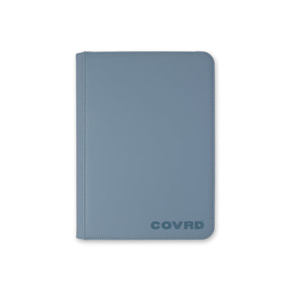 Front view of COVRD premium trading card zip binder in steel blue with embossed logo.