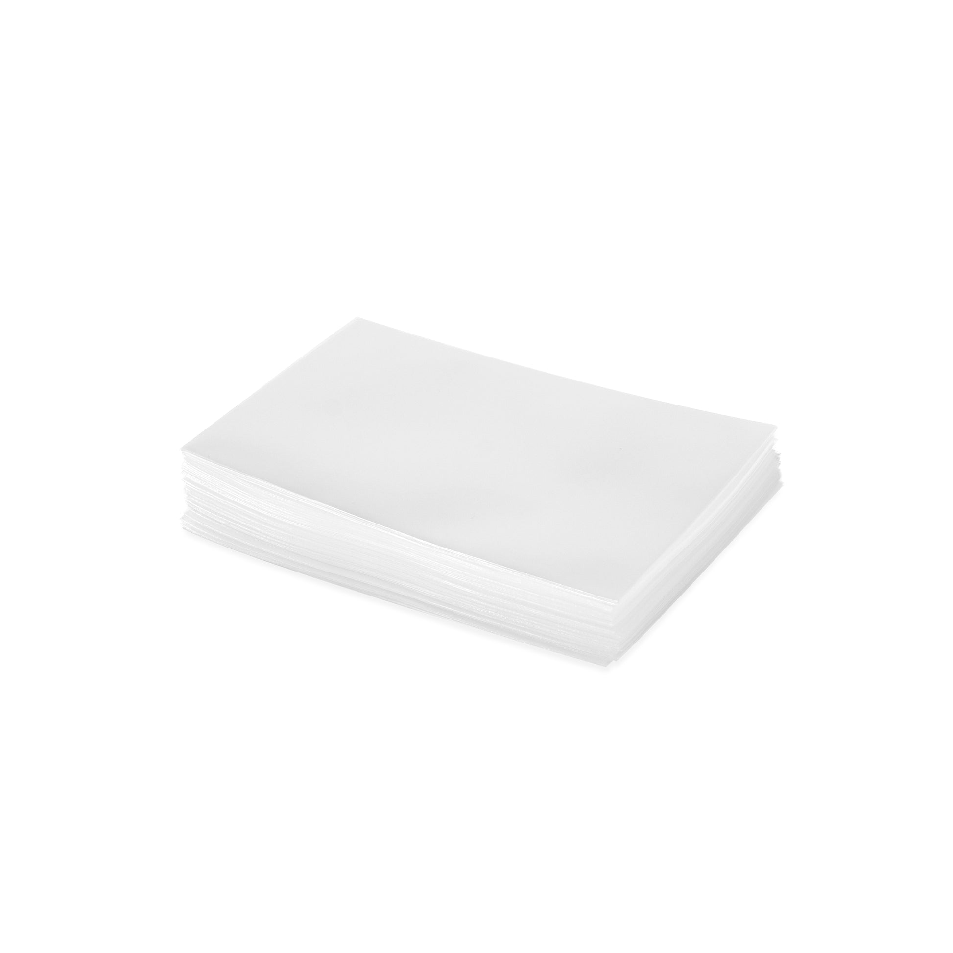 A neat stack of archival-safe, clear trading card sleeves for collectible cards.