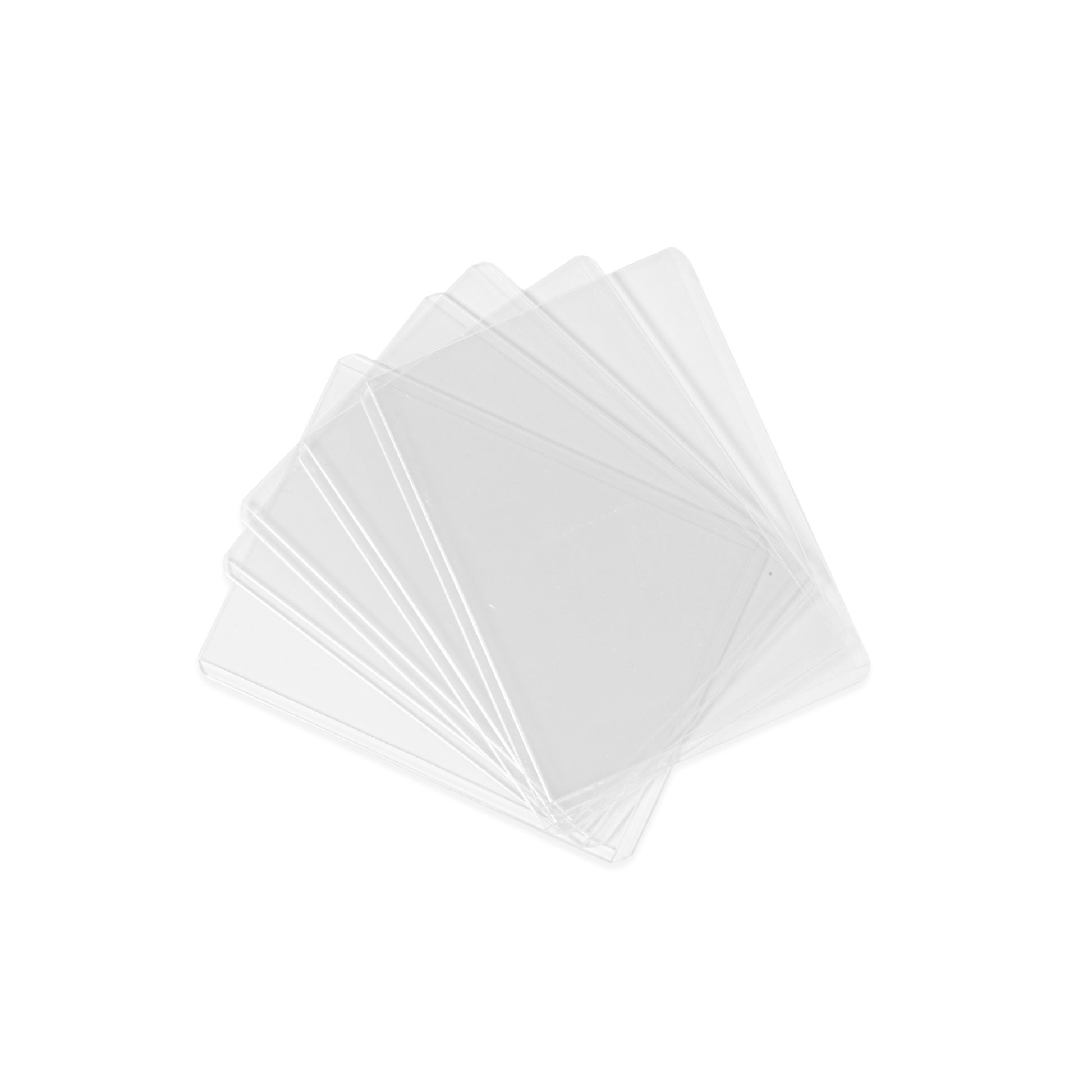 A fanned-out selection of ultra-clear, rigid trading card holders showing high-impact clarity.