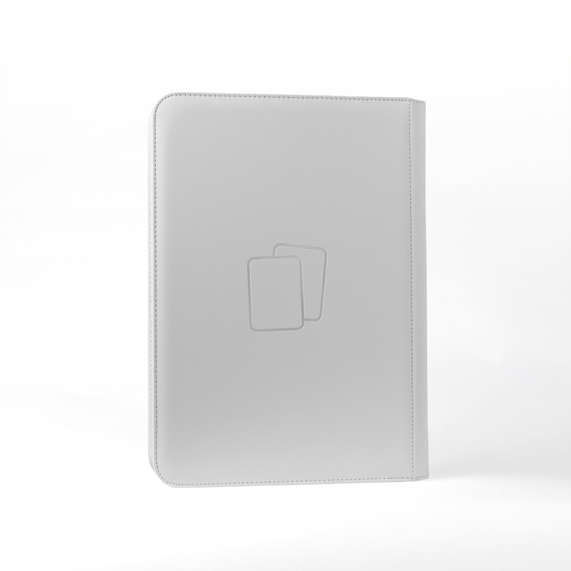 Back view of white COVRD card album standing upright showing the debossed logo asset.