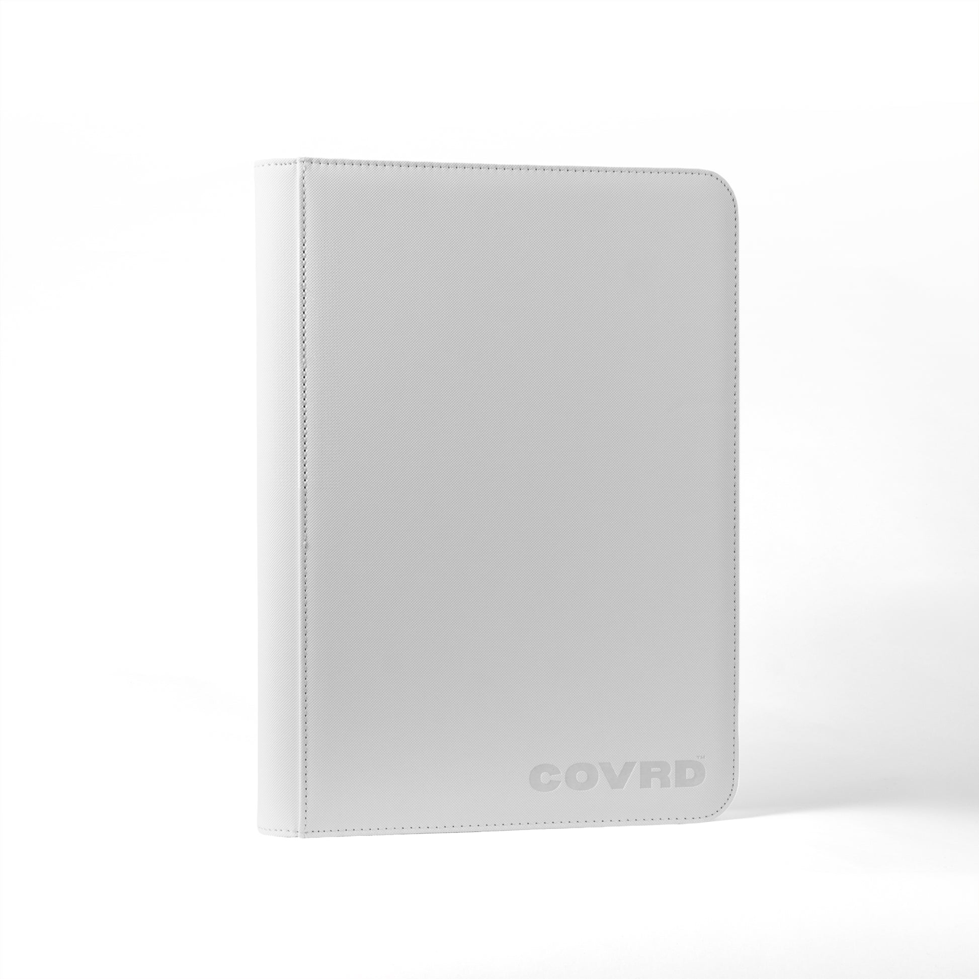 Front and spine view of white COVRD card binder standing upright showing the embossed logo.